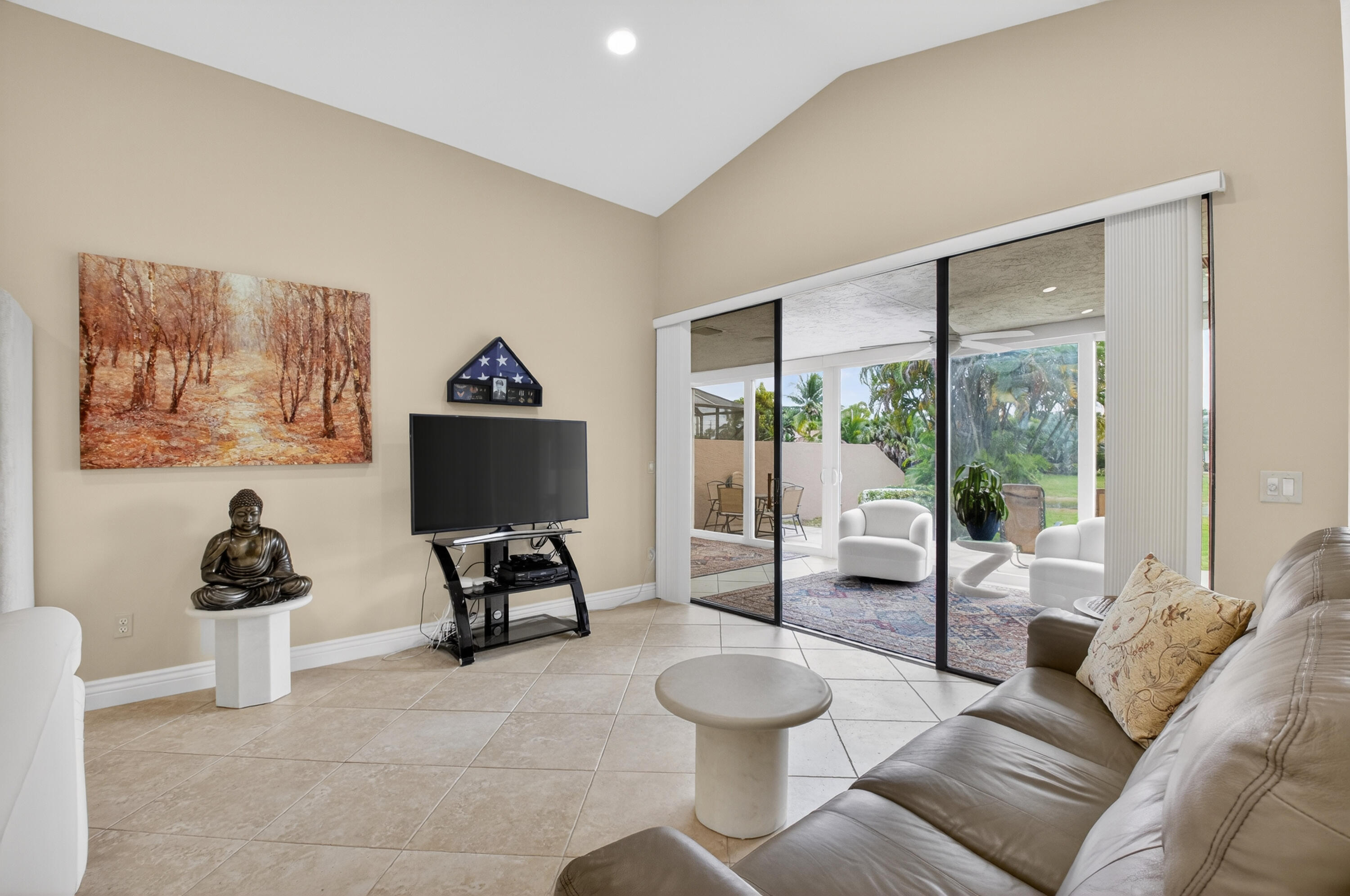 11253 Cloverleaf Circle Boca Raton, FL 33428 - Photo 14 of 79 a living room with furniture and a gate