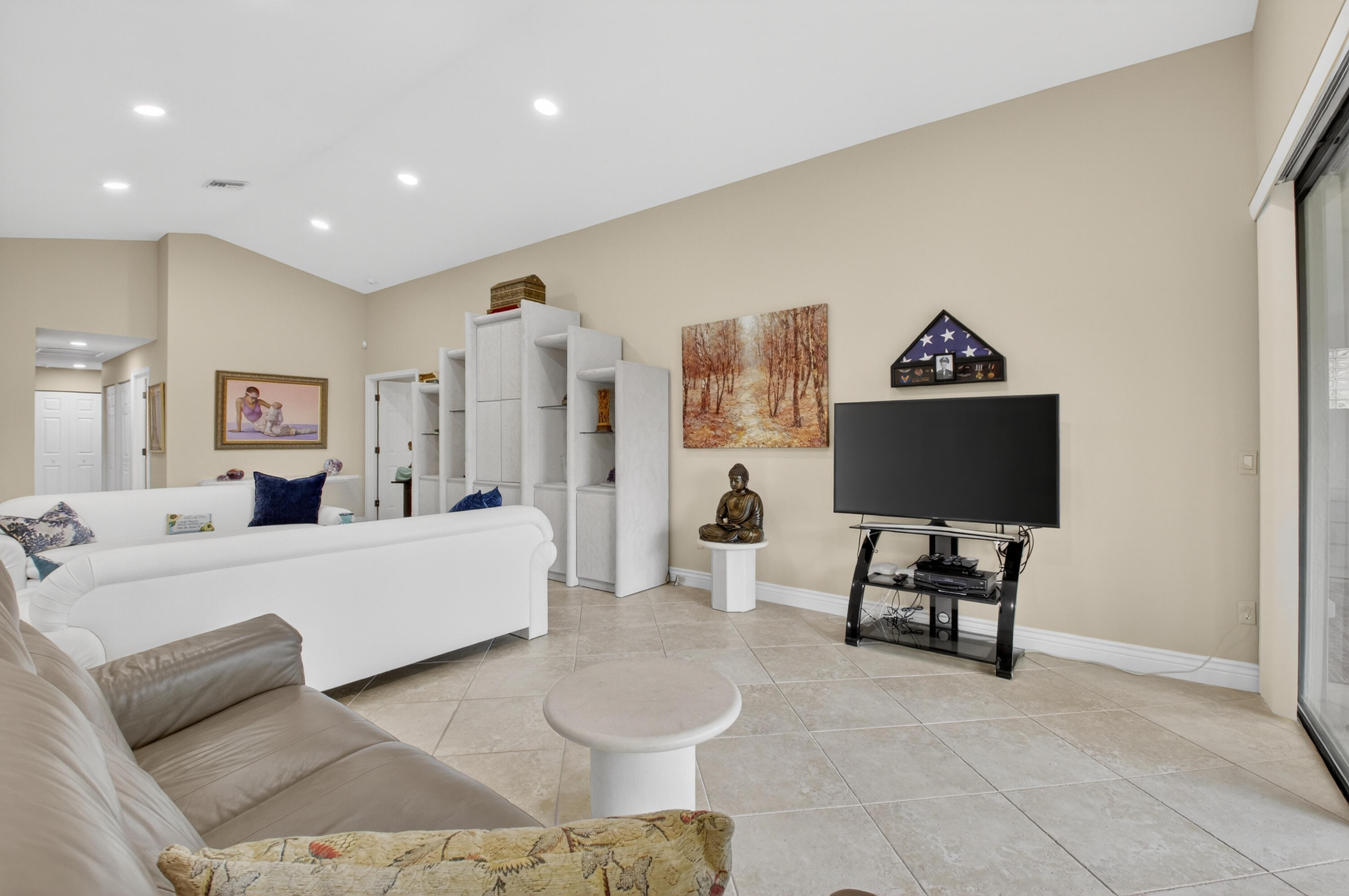 11253 Cloverleaf Circle Boca Raton, FL 33428 - Photo 15 of 79 a living room with furniture and a flat screen tv