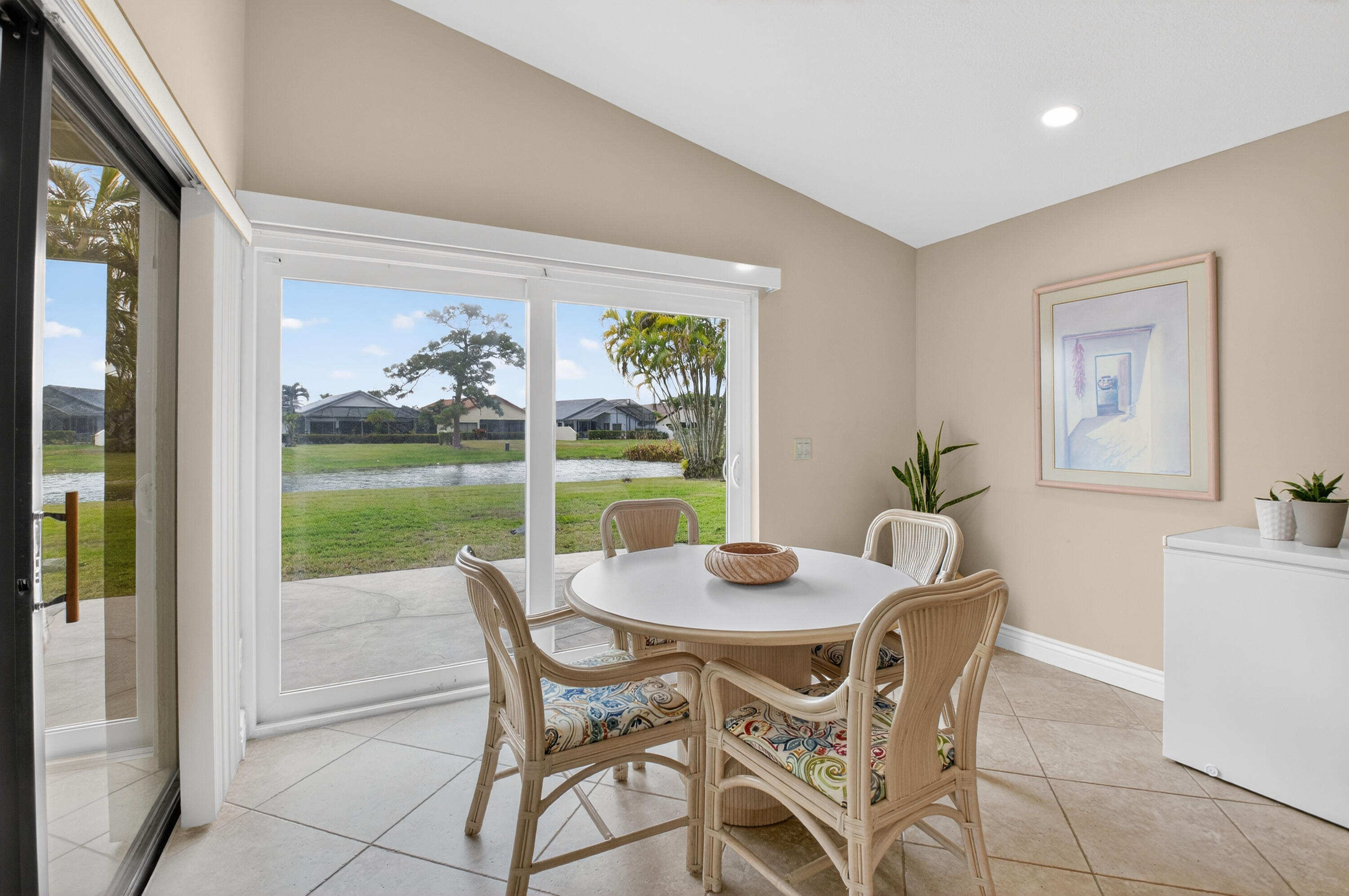11253 Cloverleaf Circle Boca Raton, FL 33428 - Photo 16 of 79 a view of a dining room with furniture window and outside view