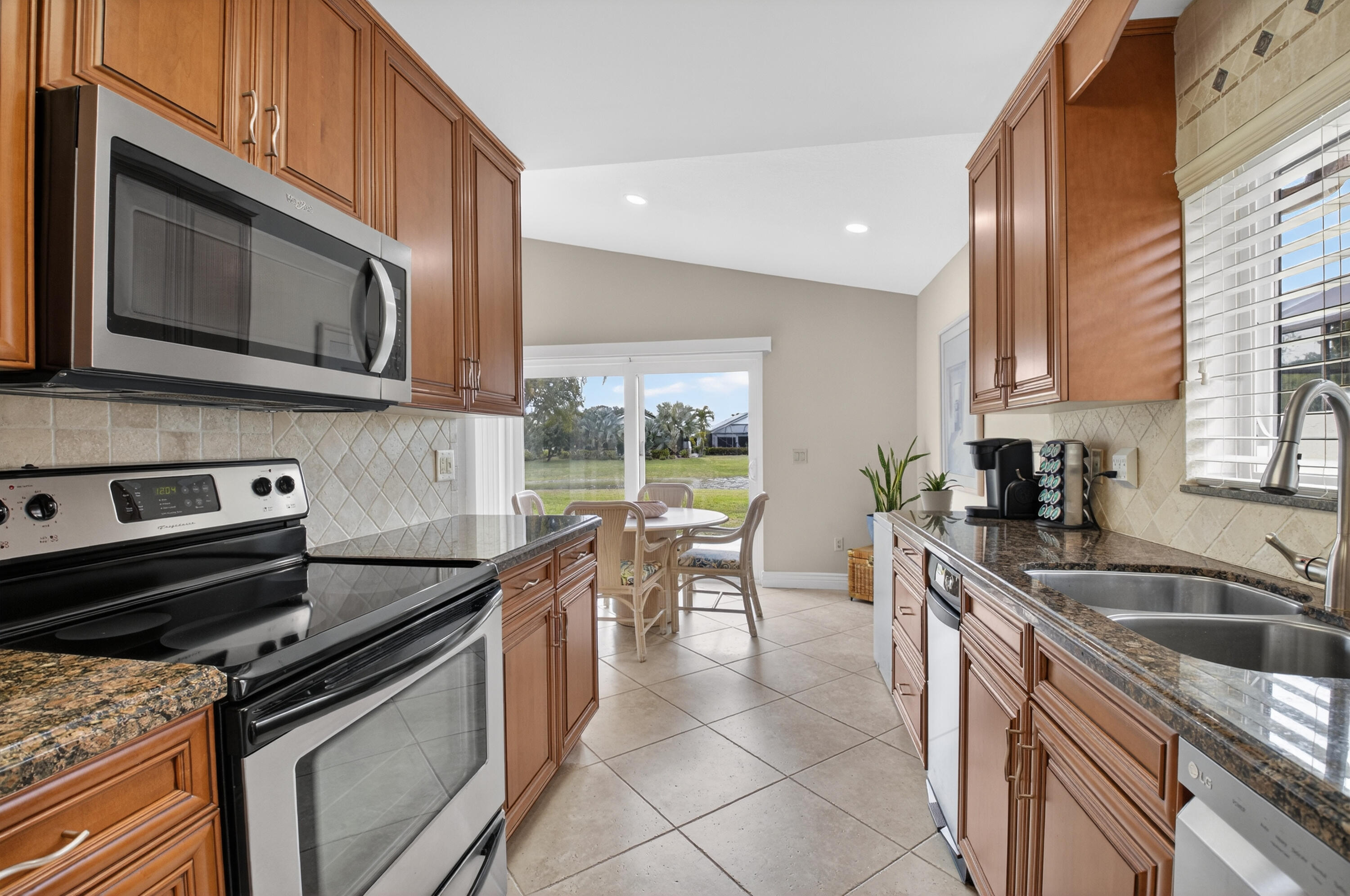 11253 Cloverleaf Circle Boca Raton, FL 33428 - Photo 23 of 79 a kitchen with a stove microwave and sink