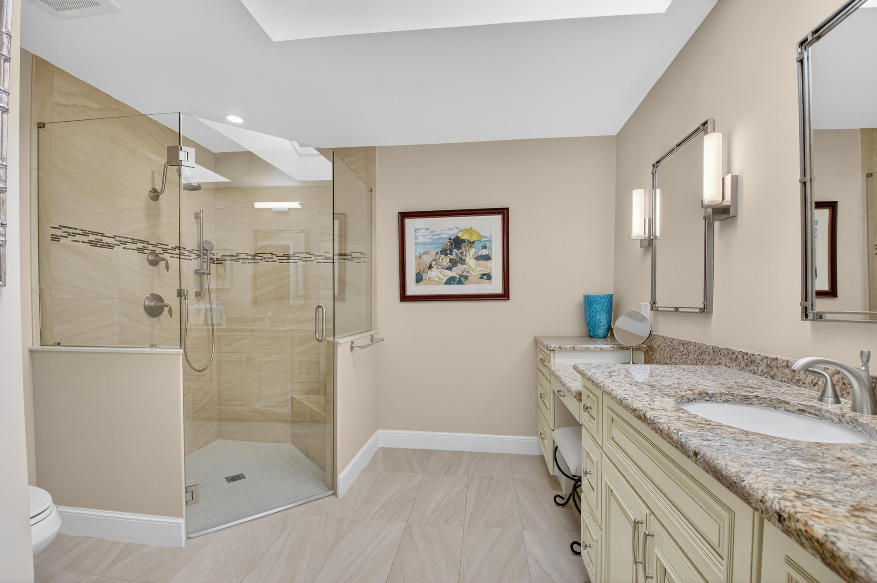 11253 Cloverleaf Circle Boca Raton, FL 33428 - Photo 31 of 79 a bathroom with a granite countertop sink a mirror a shower and a bathtub