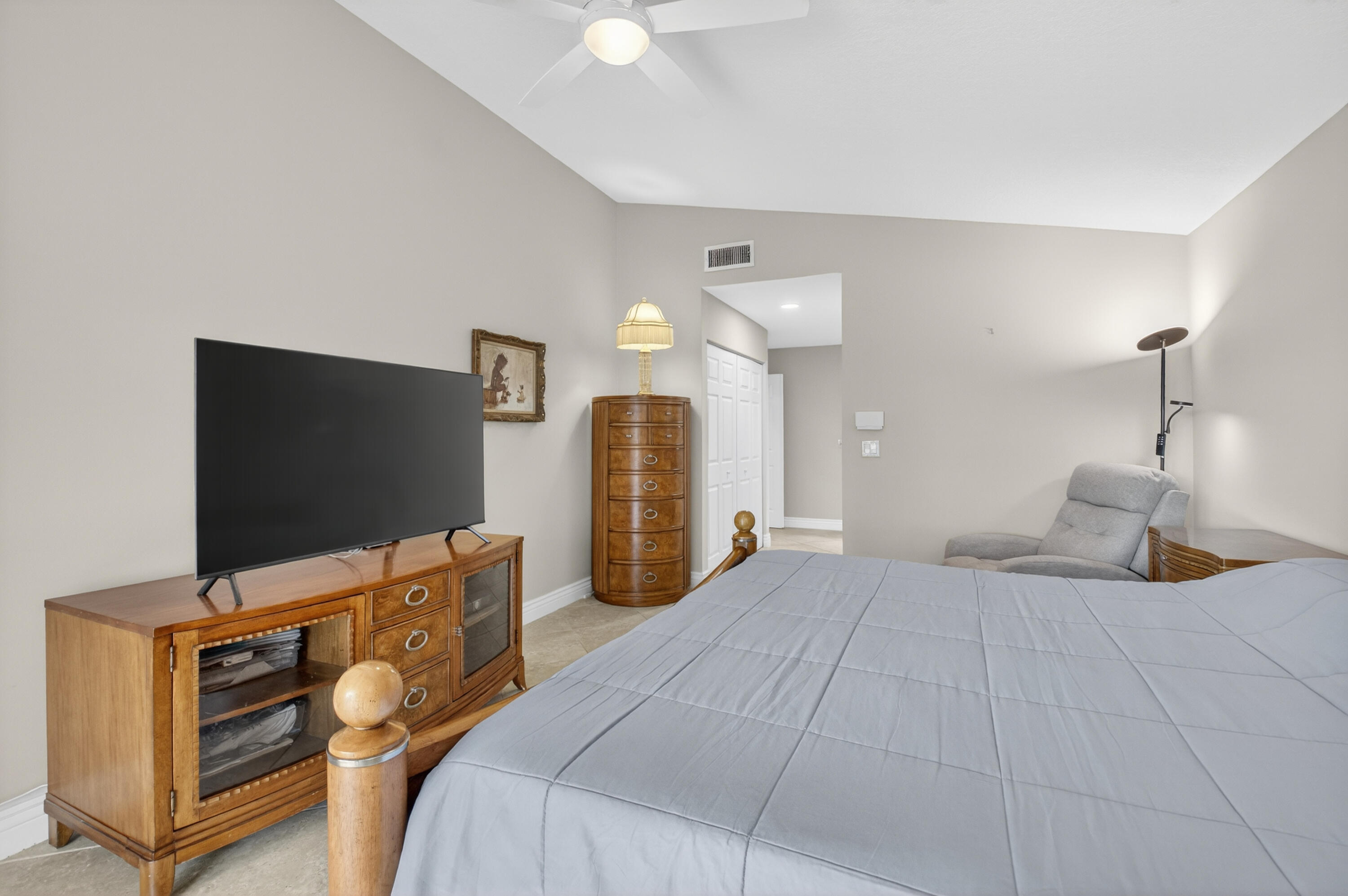 11253 Cloverleaf Circle Boca Raton, FL 33428 - Photo 33 of 79 a bedroom with a bed and a flat screen tv