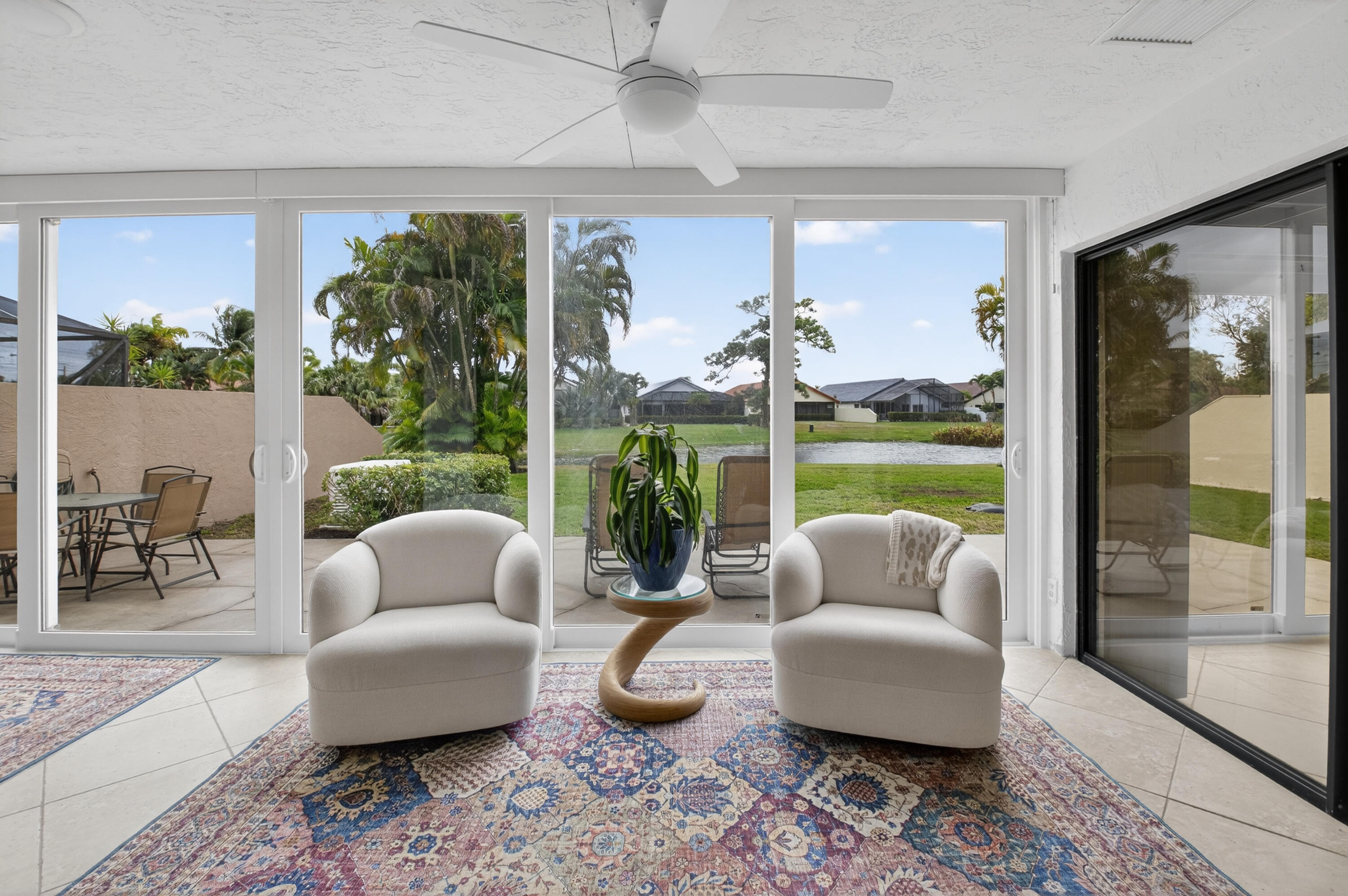 11253 Cloverleaf Circle Boca Raton, FL 33428 - Photo 36 of 79 a living room with furniture and a large window