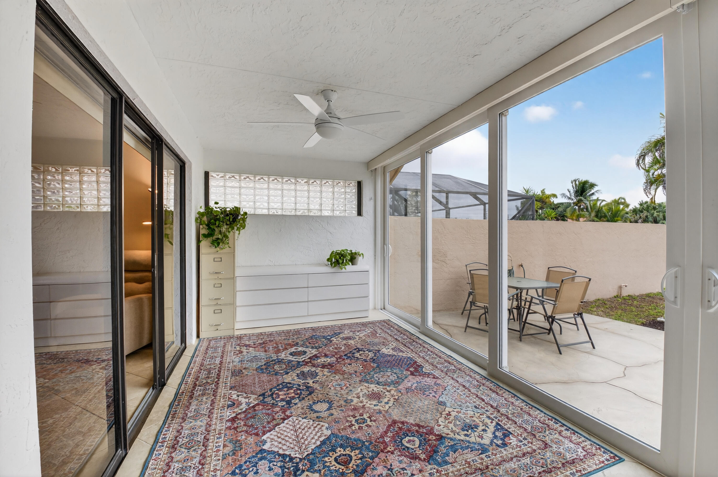 11253 Cloverleaf Circle Boca Raton, FL 33428 - Photo 38 of 79 a view of a hallway with wooden floor and glass door