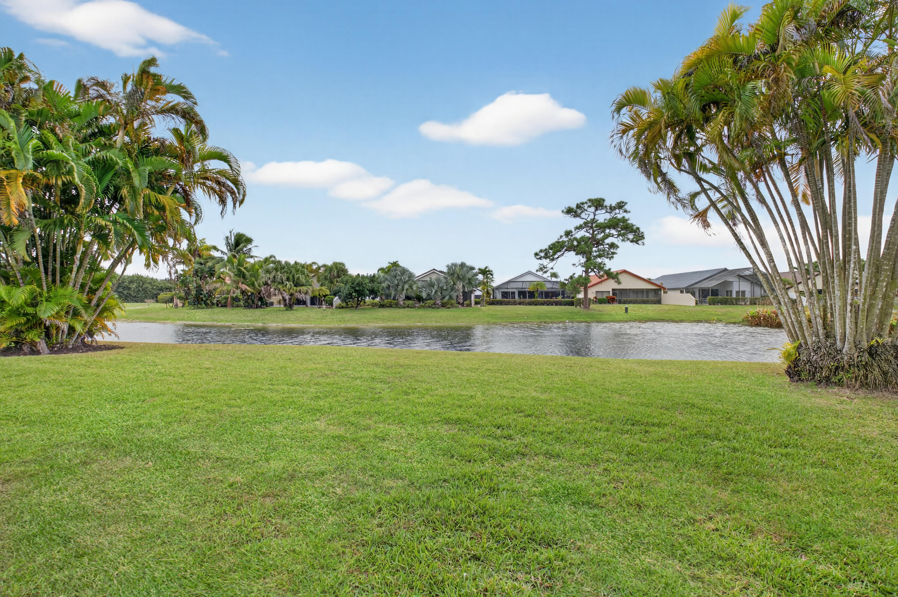 11253 Cloverleaf Circle Boca Raton, FL 33428 - Photo 44 of 79 a view of a lake with houses in the background