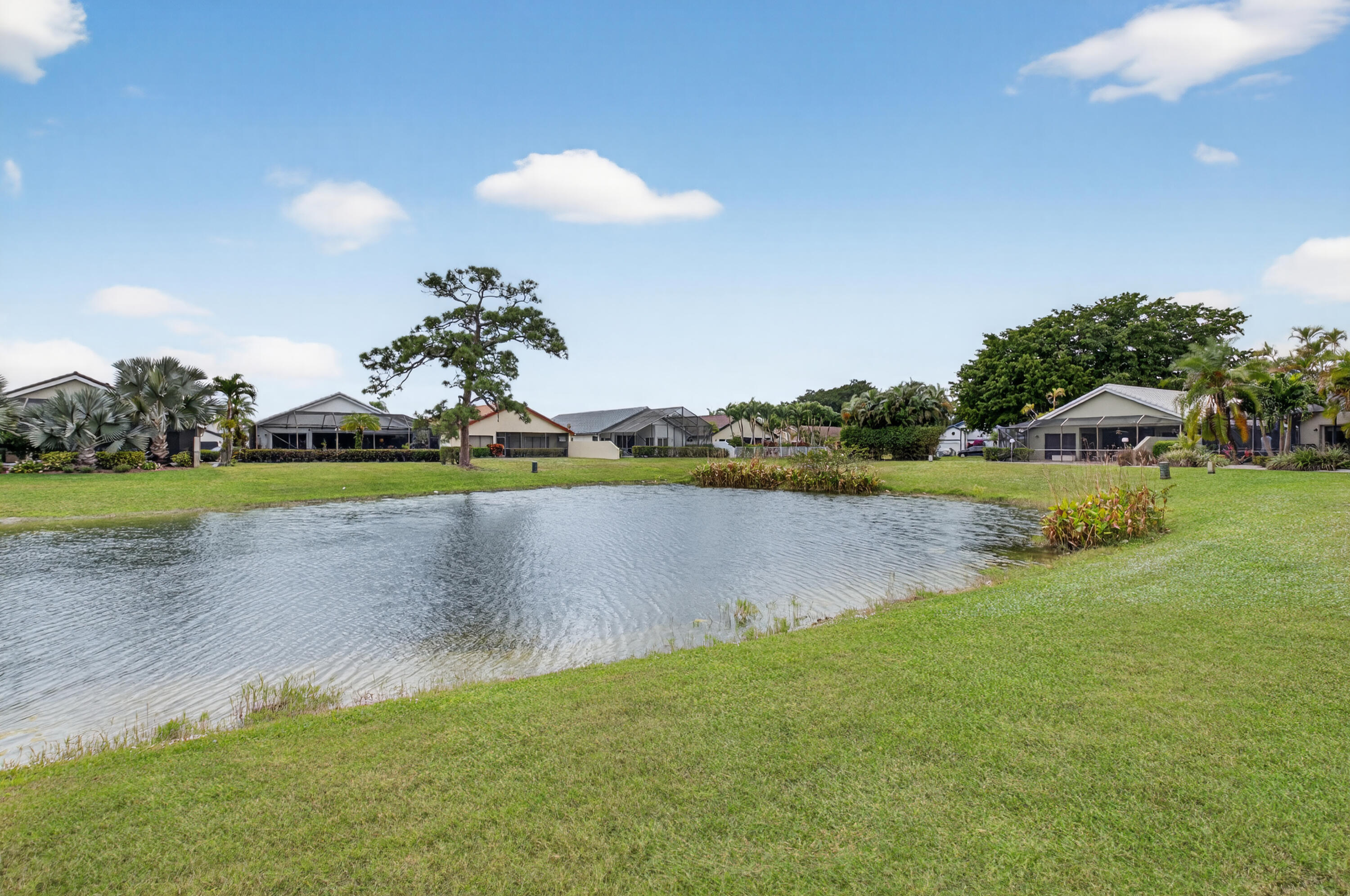 11253 Cloverleaf Circle Boca Raton, FL 33428 - Photo 46 of 79 a view of a lake with a big yard