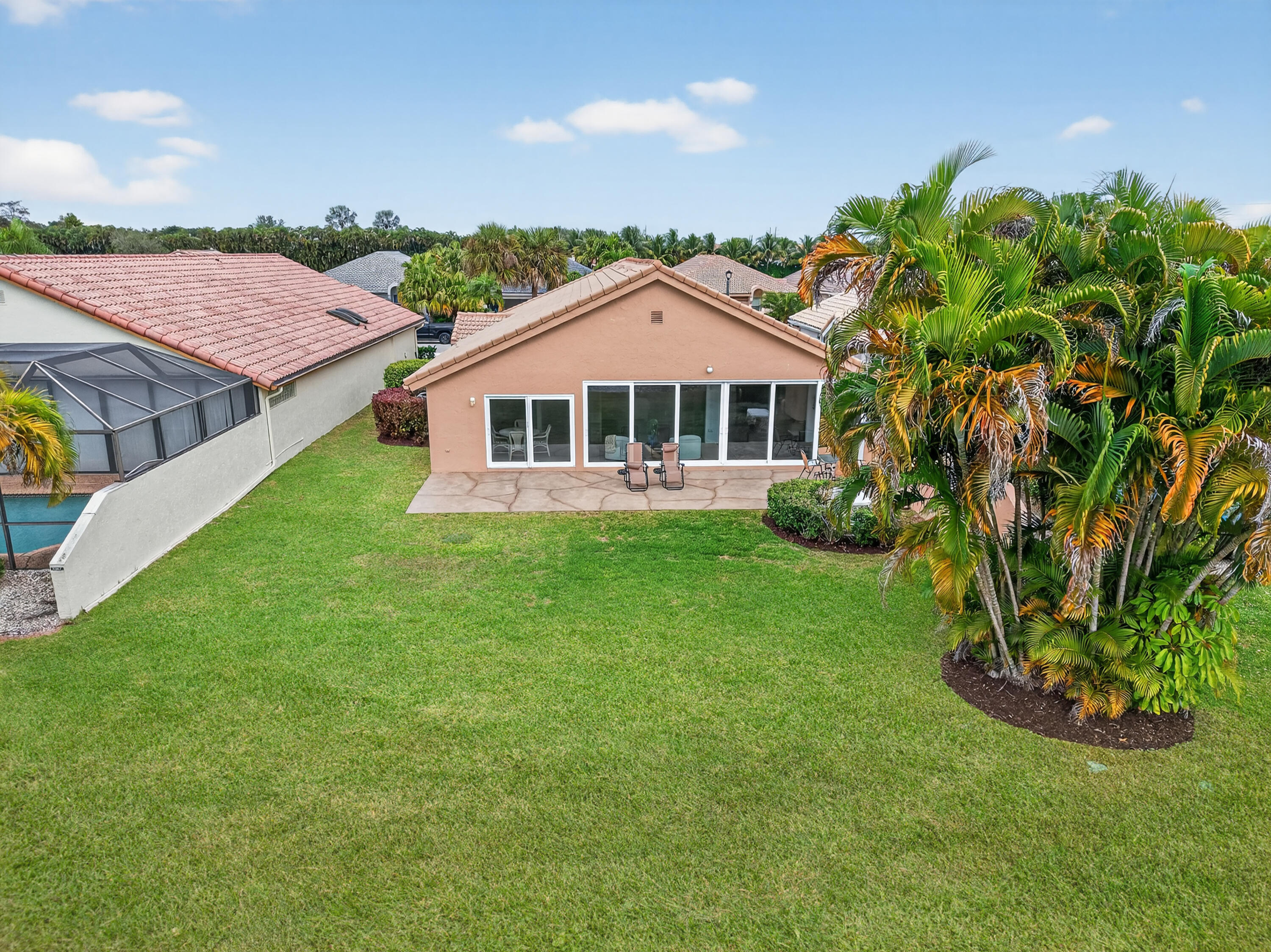 11253 Cloverleaf Circle Boca Raton, FL 33428 - Photo 50 of 79 a front view of a house with a garden