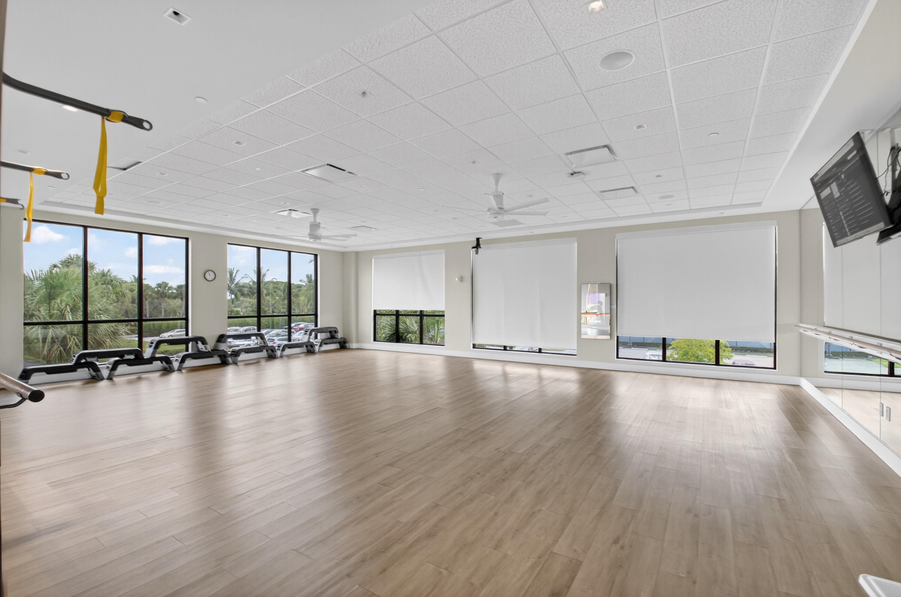 11253 Cloverleaf Circle Boca Raton, FL 33428 - Photo 68 of 79 a view of empty room with wooden floor and floor to ceiling window