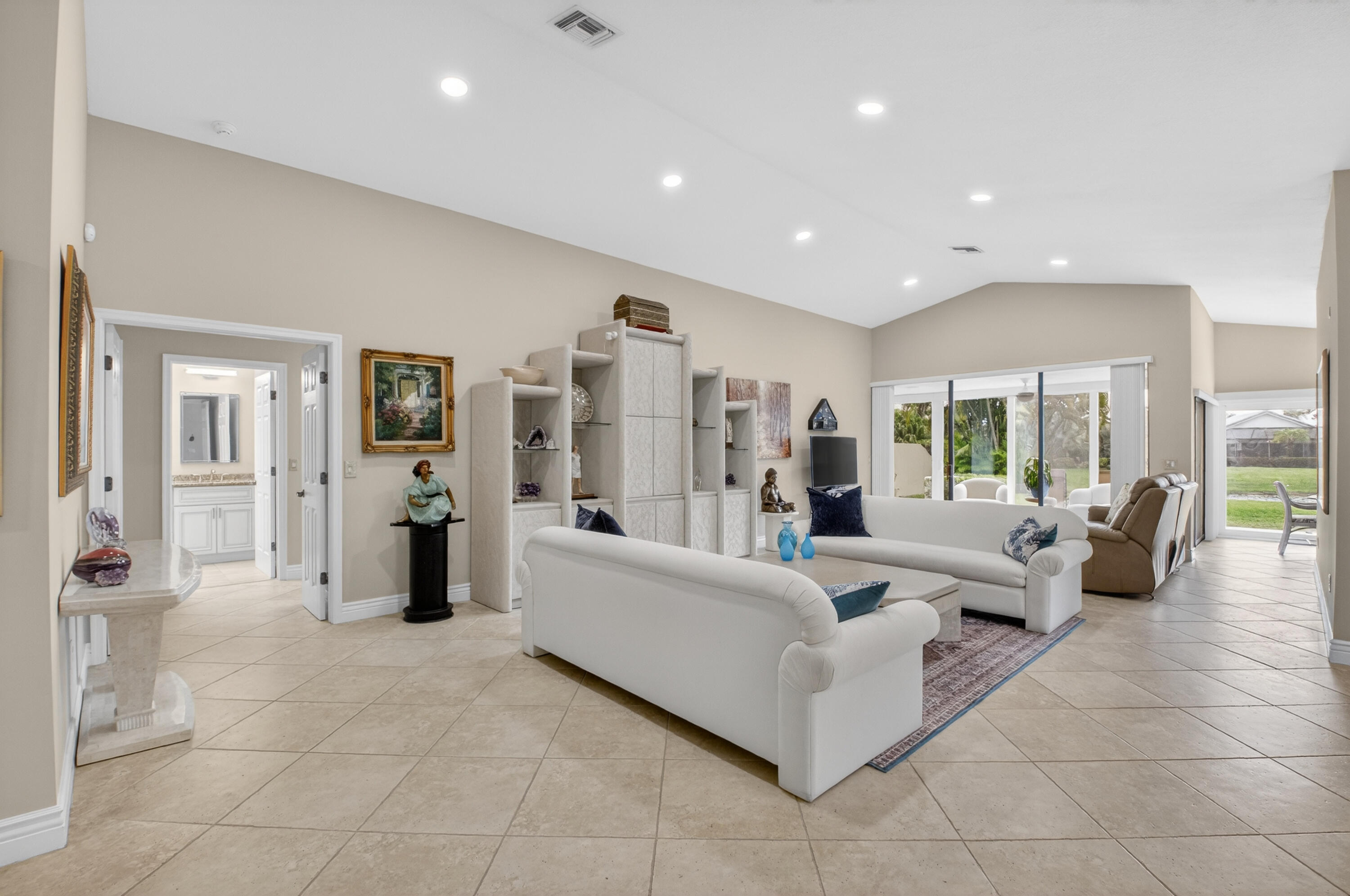 11253 Cloverleaf Circle Boca Raton, FL 33428 - Photo 10 of 79 a living room with furniture and large glass door