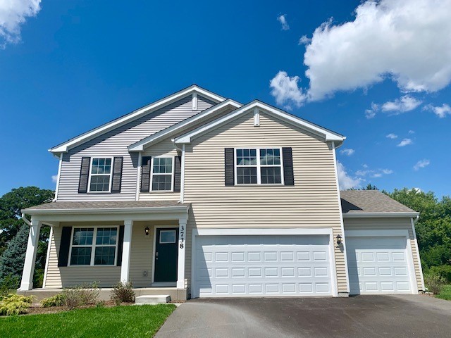 3738 Doherty Lane McHenry, IL 60050 - Photo 1 of 12 a front view of a house with garden