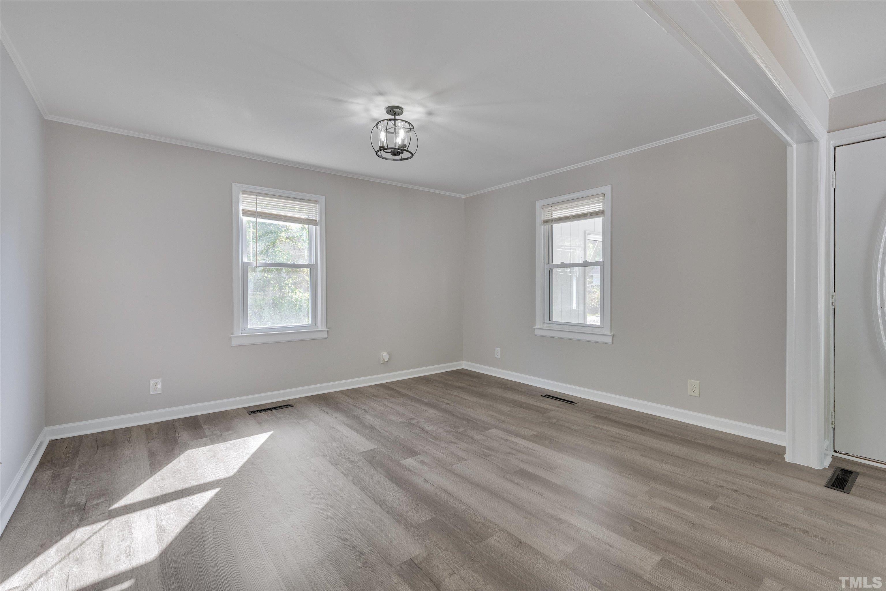 308 South Mineral Springs Road Durham, NC 27703 - Photo 12 of 42 wooden floor in an empty room with a window