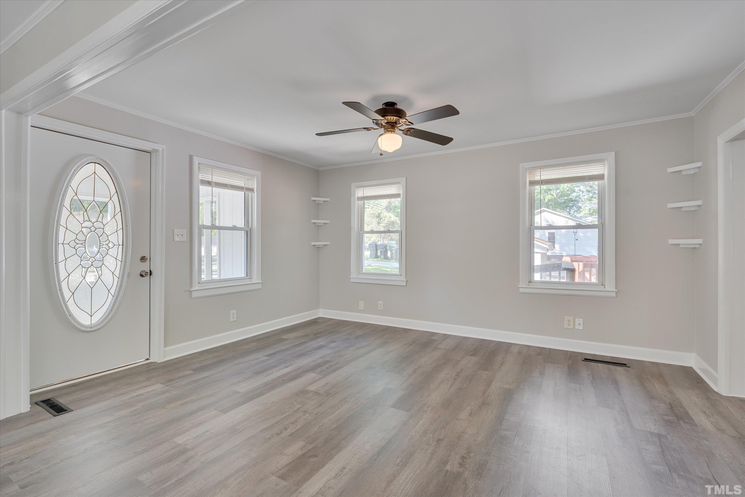 308 South Mineral Springs Road Durham, NC 27703 - Photo 13 of 42 a view of an empty room with a window and wooden floor