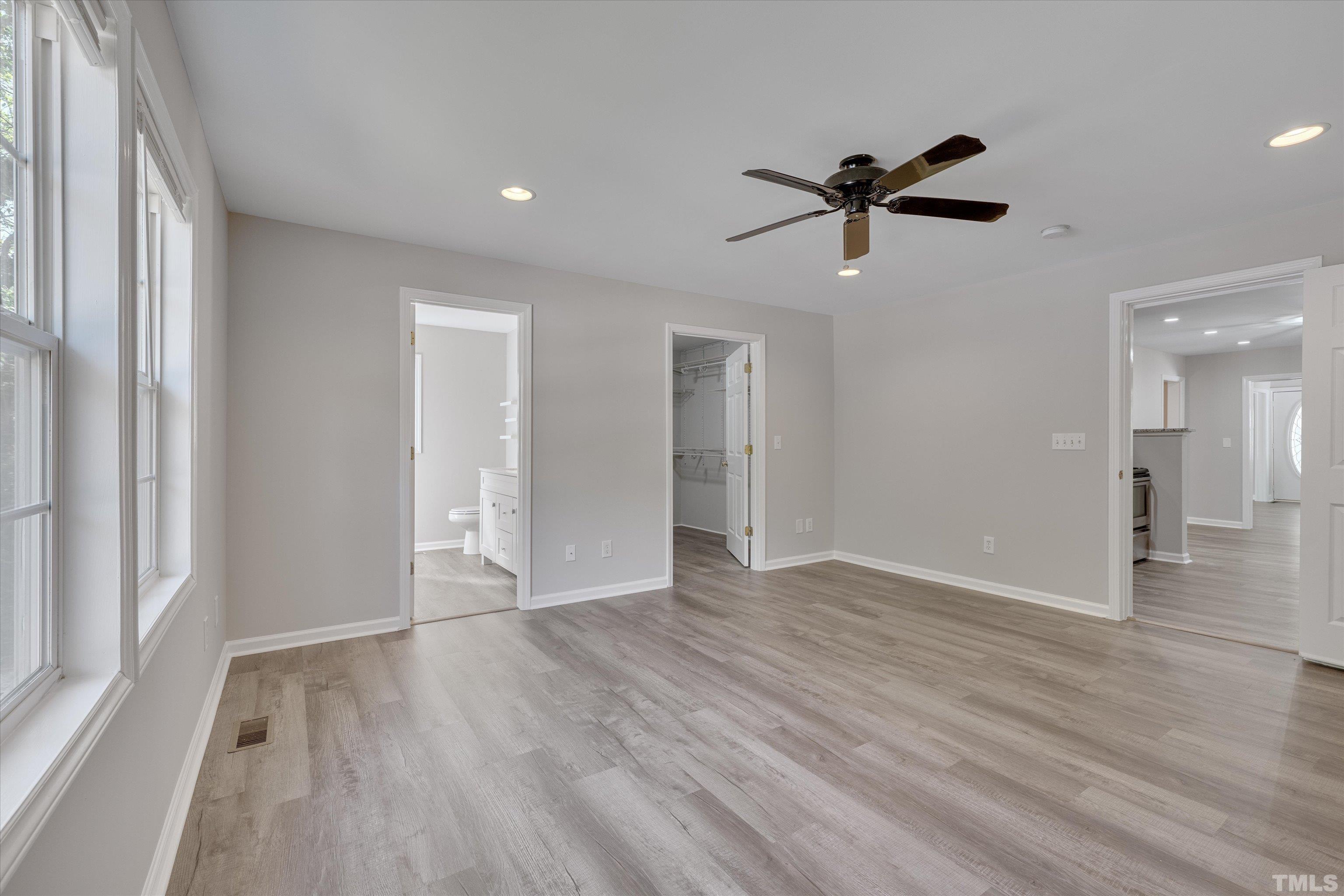 308 South Mineral Springs Road Durham, NC 27703 - Photo 18 of 42 a view of empty room with wooden floor and fan