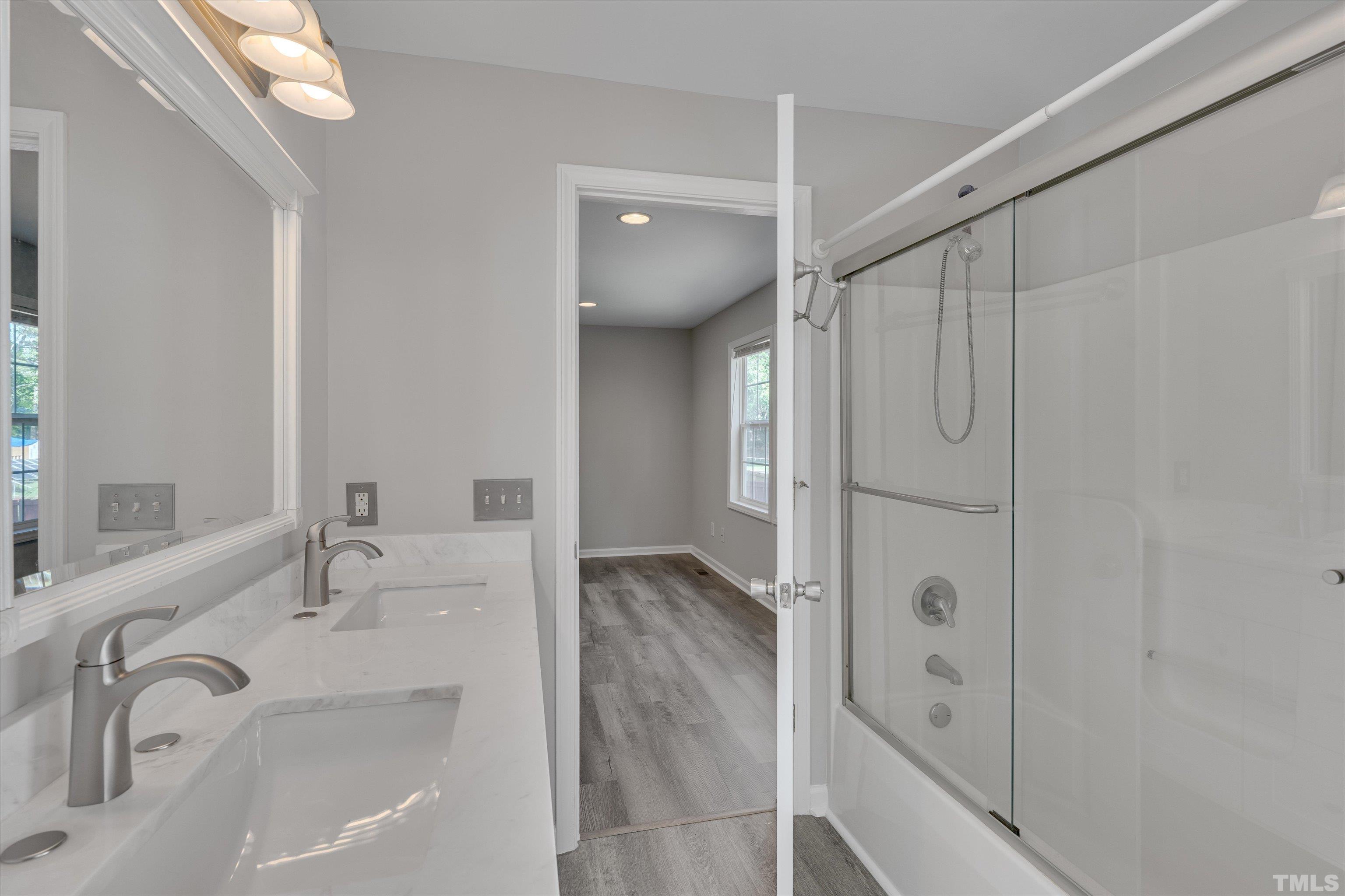 308 South Mineral Springs Road Durham, NC 27703 - Photo 20 of 42 a bathroom with a sink and a mirror
