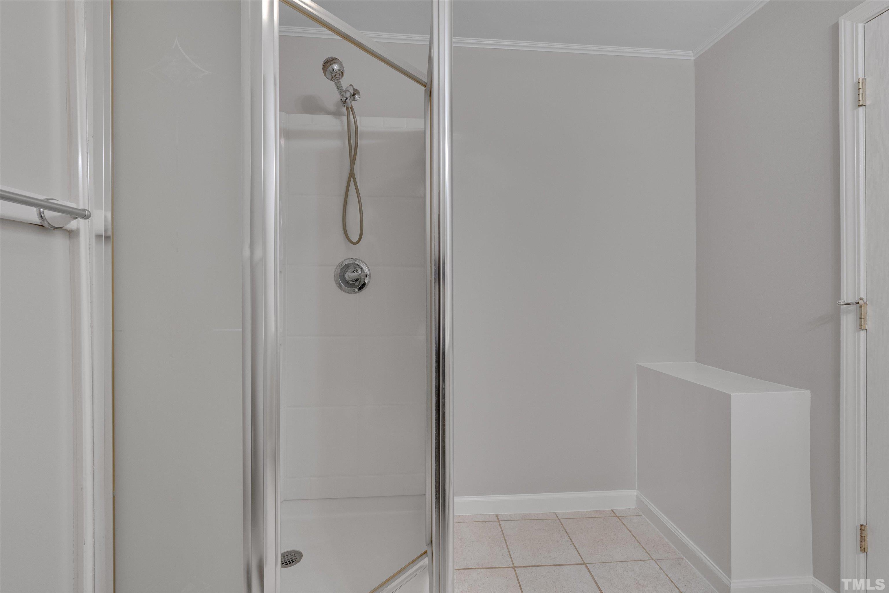 308 South Mineral Springs Road Durham, NC 27703 - Photo 23 of 42 a bathroom with a glass shower door