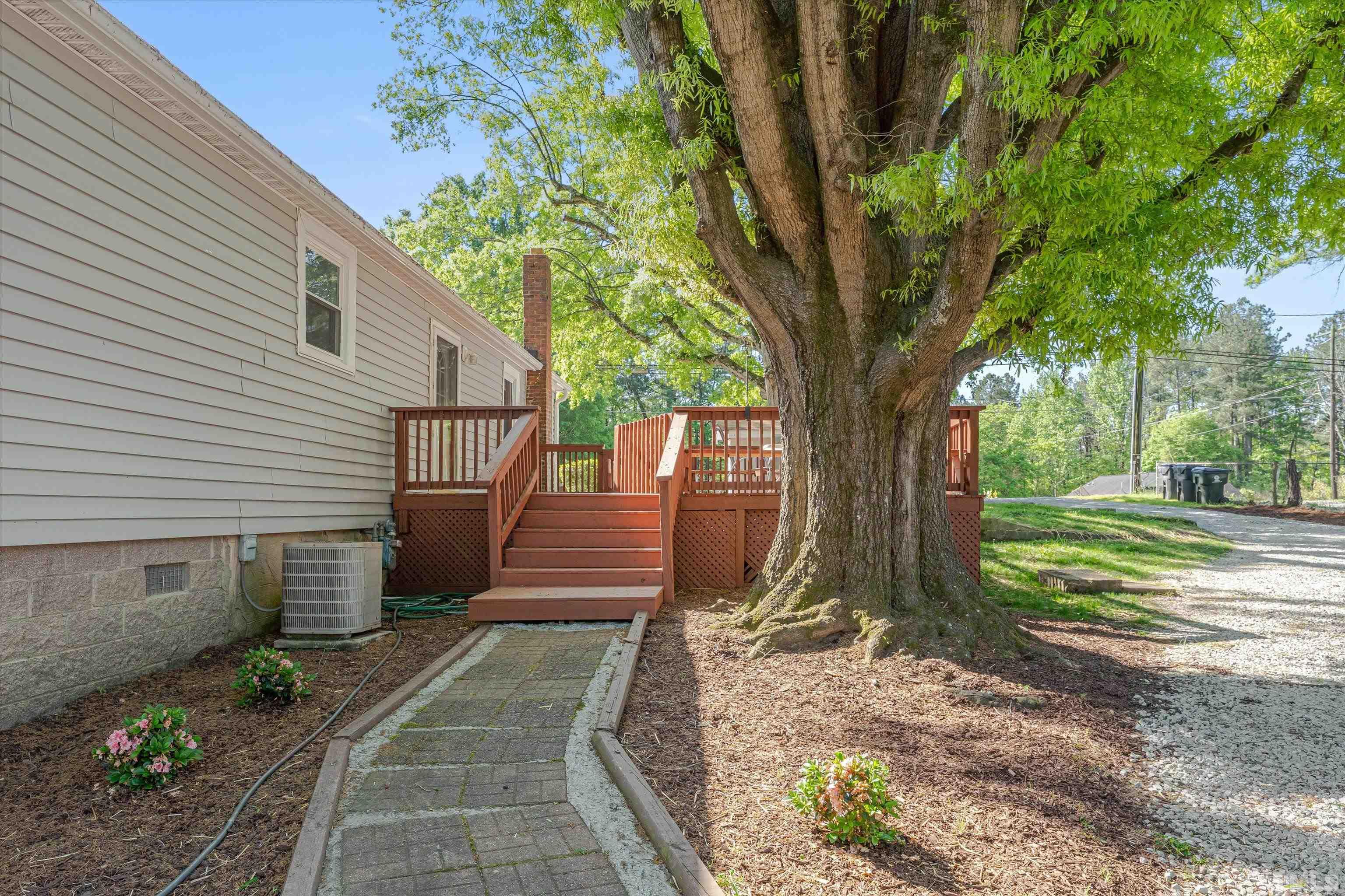308 South Mineral Springs Road Durham, NC 27703 - Photo 28 of 42 a view of a backyard with pathway