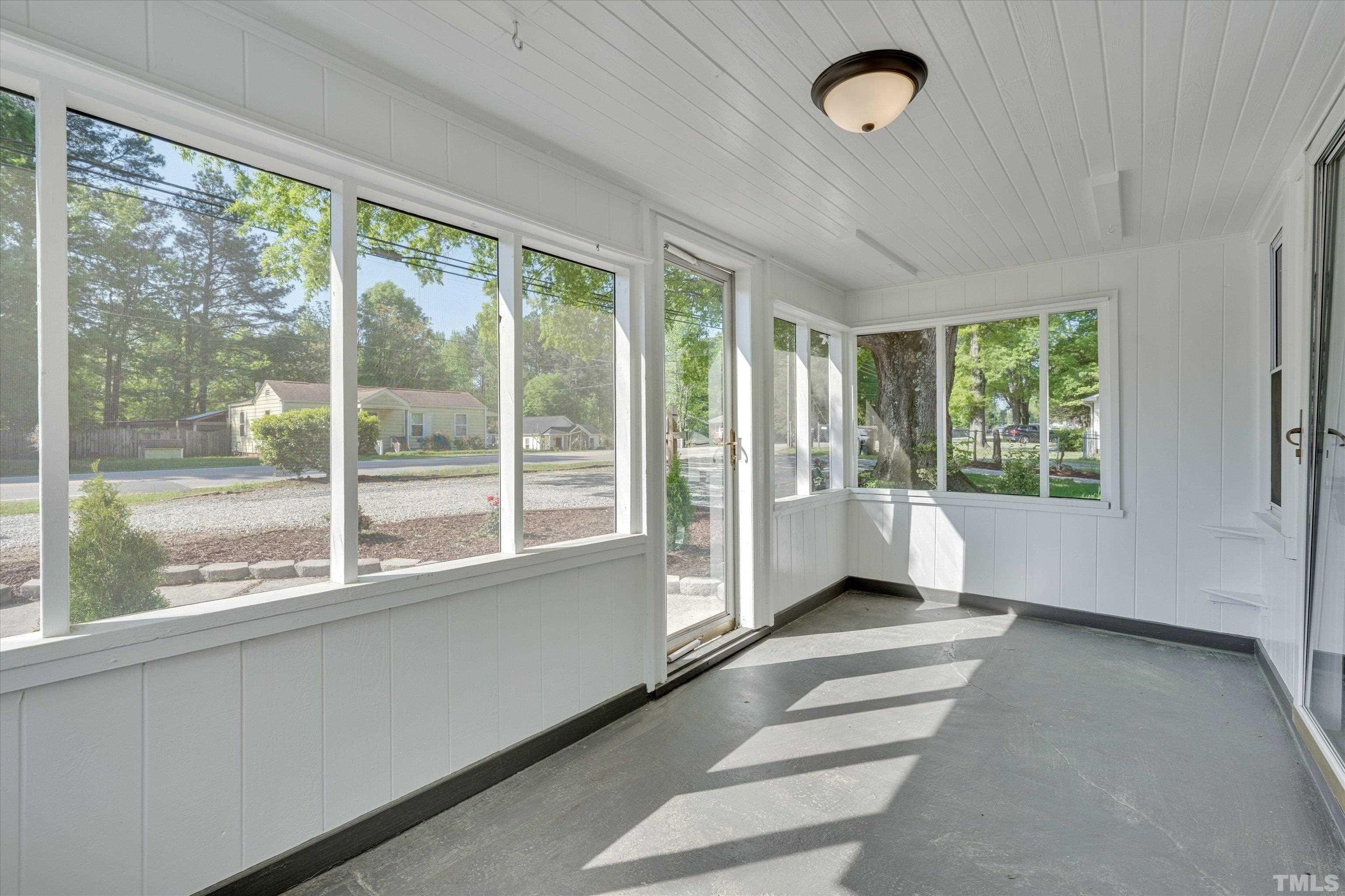 308 South Mineral Springs Road Durham, NC 27703 - Photo 9 of 42 a living room with furniture and windows