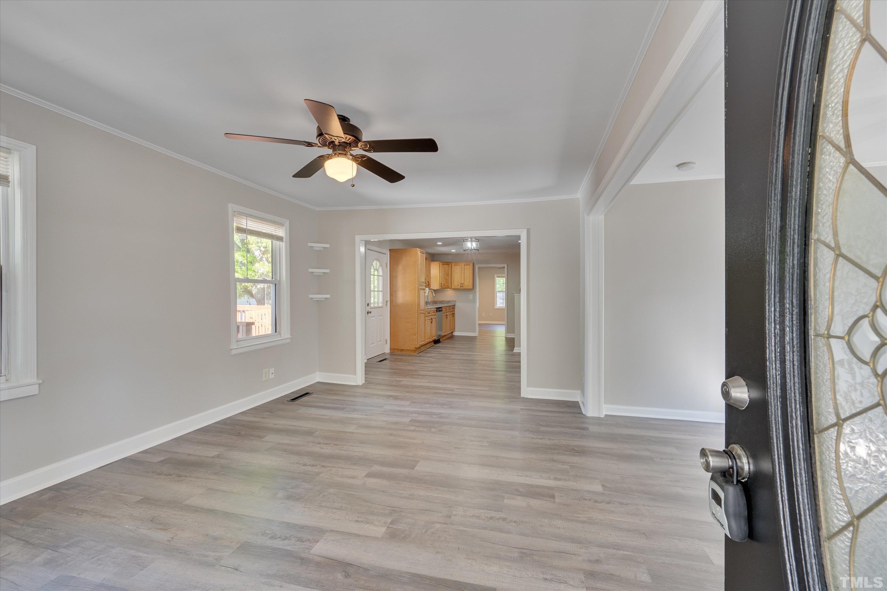 308 South Mineral Springs Road Durham, NC 27703 - Photo 10 of 42 wooden floor in an empty room with a window