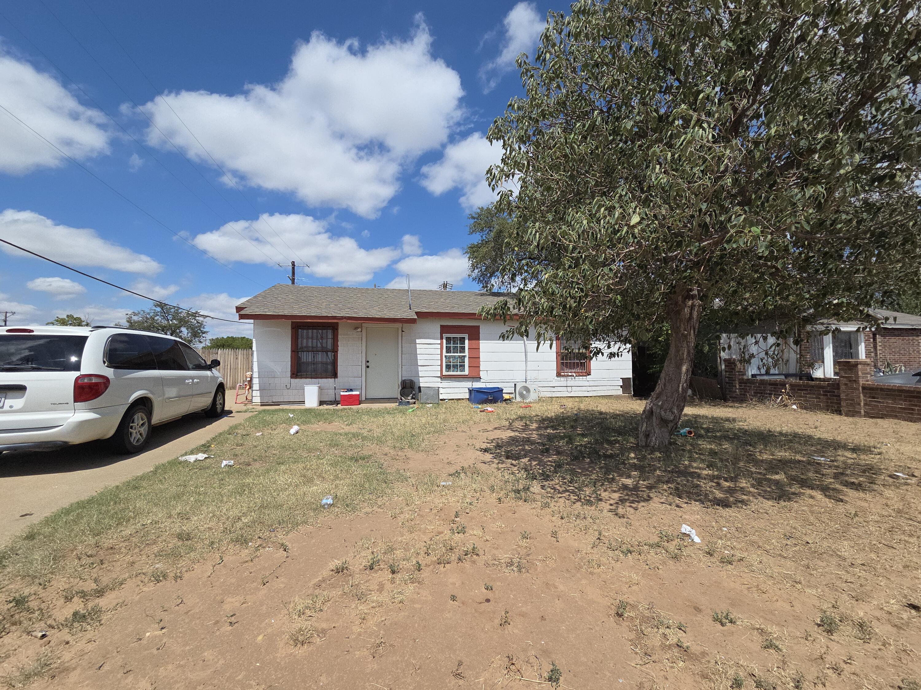 a view of a car parked in front of house