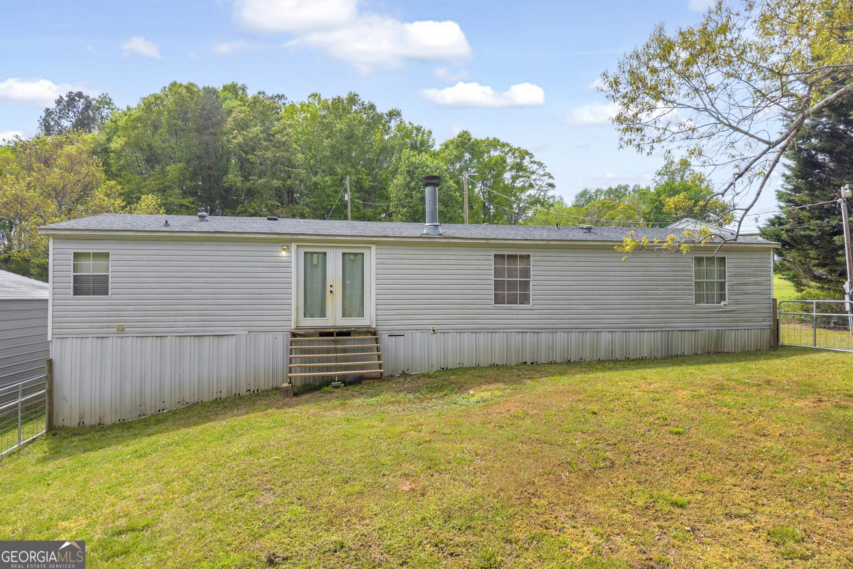 35 Jordan Loop Toccoa, GA 30577 - Photo 16 of 49 a view of a house with a backyard and a tree