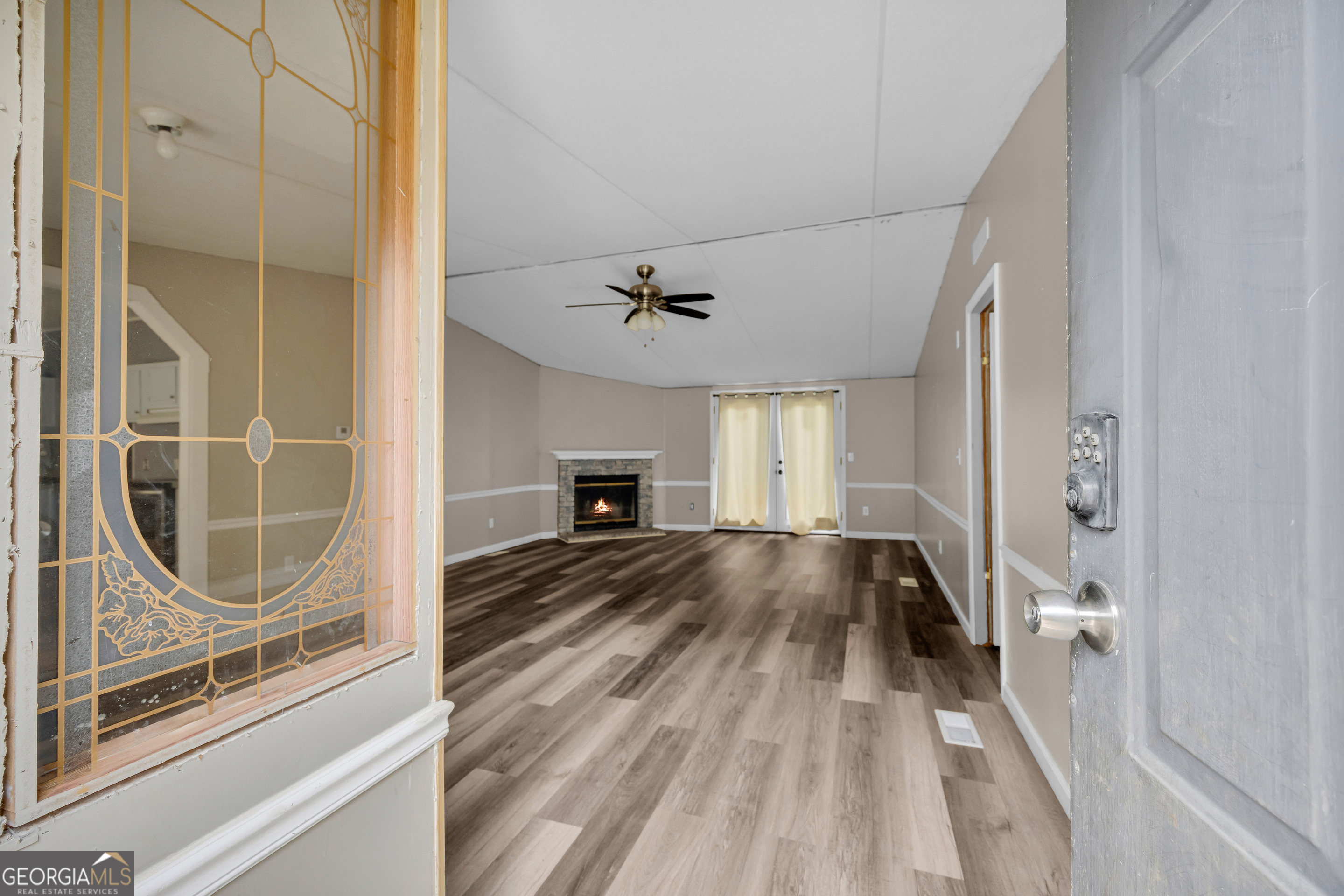 35 Jordan Loop Toccoa, GA 30577 - Photo 24 of 49 a view of empty room with wooden floor and fan