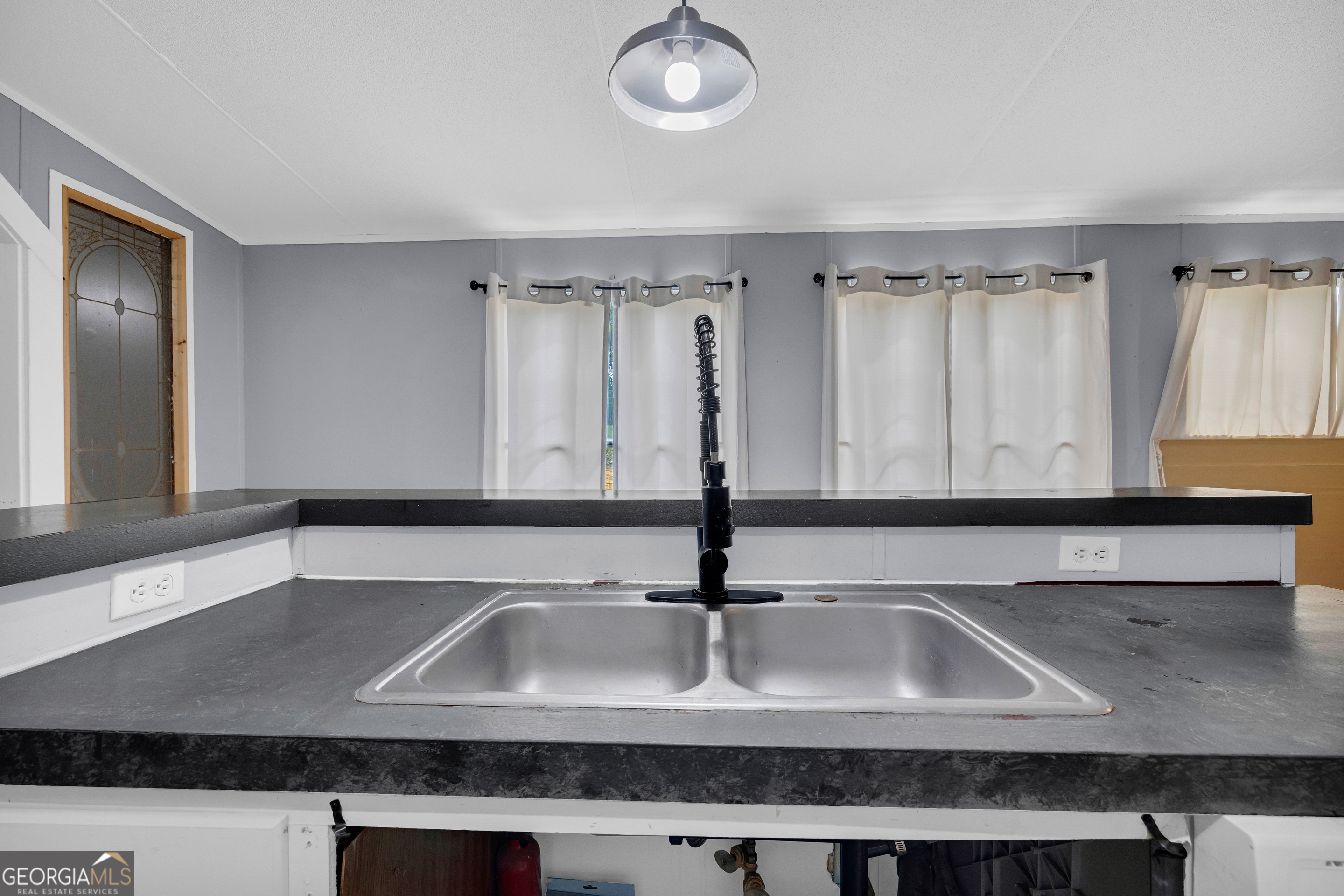 35 Jordan Loop Toccoa, GA 30577 - Photo 39 of 49 a kitchen with stainless steel appliances granite countertop a sink and a white stove