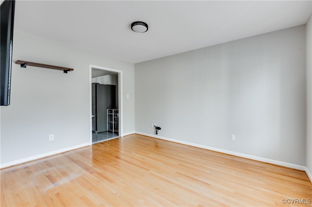 12262 Church Road Henrico, VA 23233 - Photo 21 of 50 Empty room with baseboards and wood finished floor