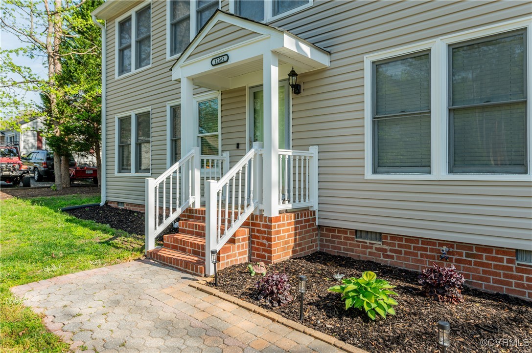 Doorway to property with crawl space