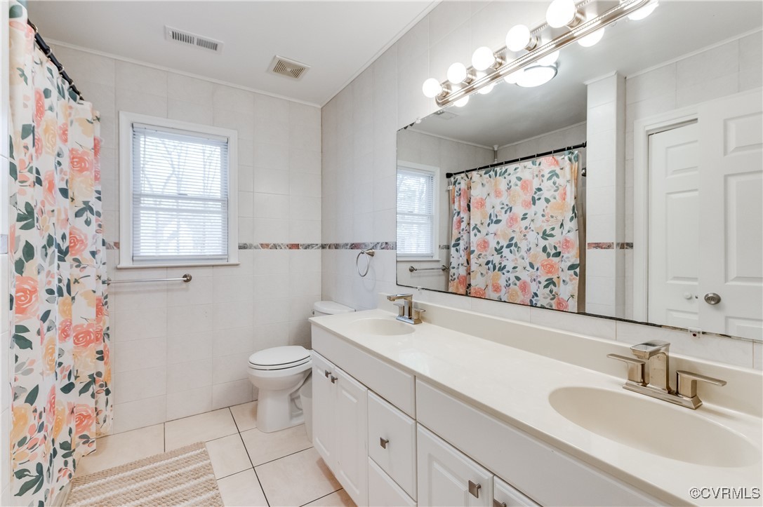 12262 Church Road Henrico, VA 23233 - Photo 32 of 50 Bathroom with tile patterned floors, a sink, and v