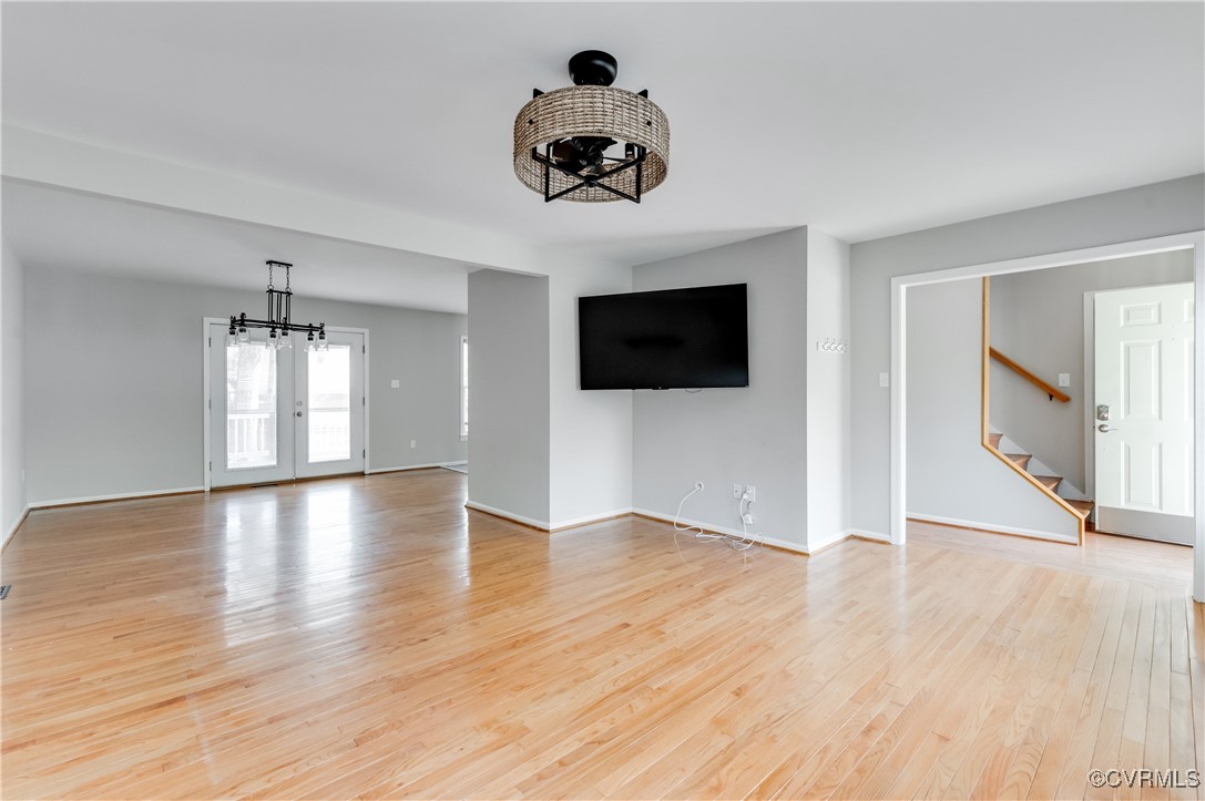 Unfurnished living room featuring a notable chande