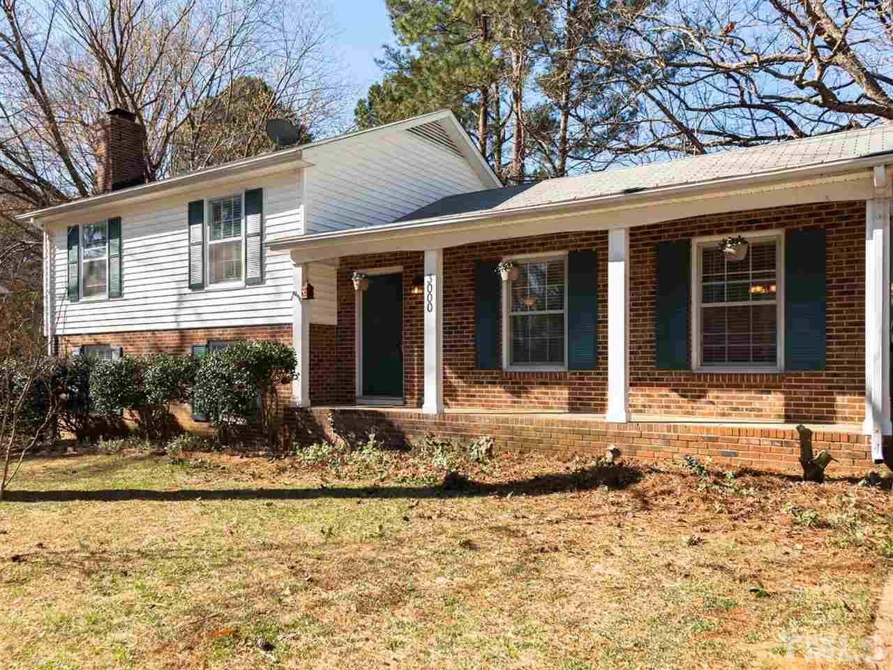 3000 Morningside Drive Raleigh, NC 27607 - Photo 1 of 25 a front view of a house with a yard and glass windows