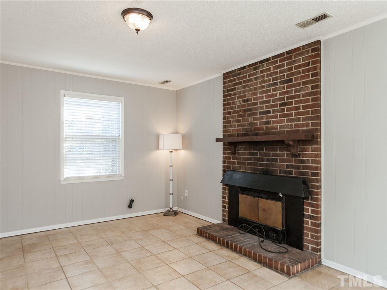 3000 Morningside Drive Raleigh, NC 27607 - Photo 19 of 25 a view of empty room with fireplace and window