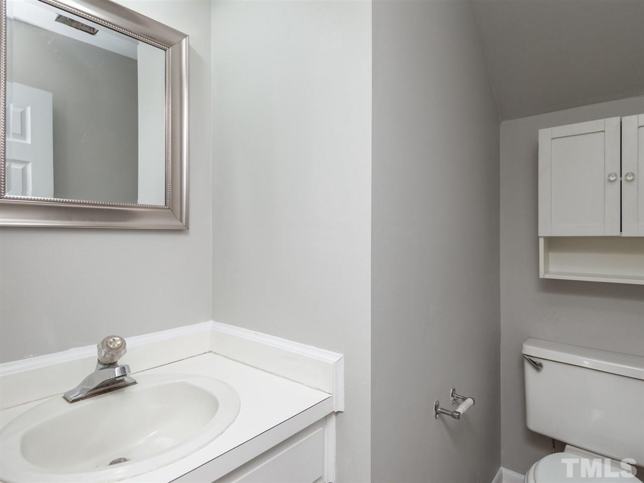 3000 Morningside Drive Raleigh, NC 27607 - Photo 21 of 25 a bathroom with a sink and a toilet