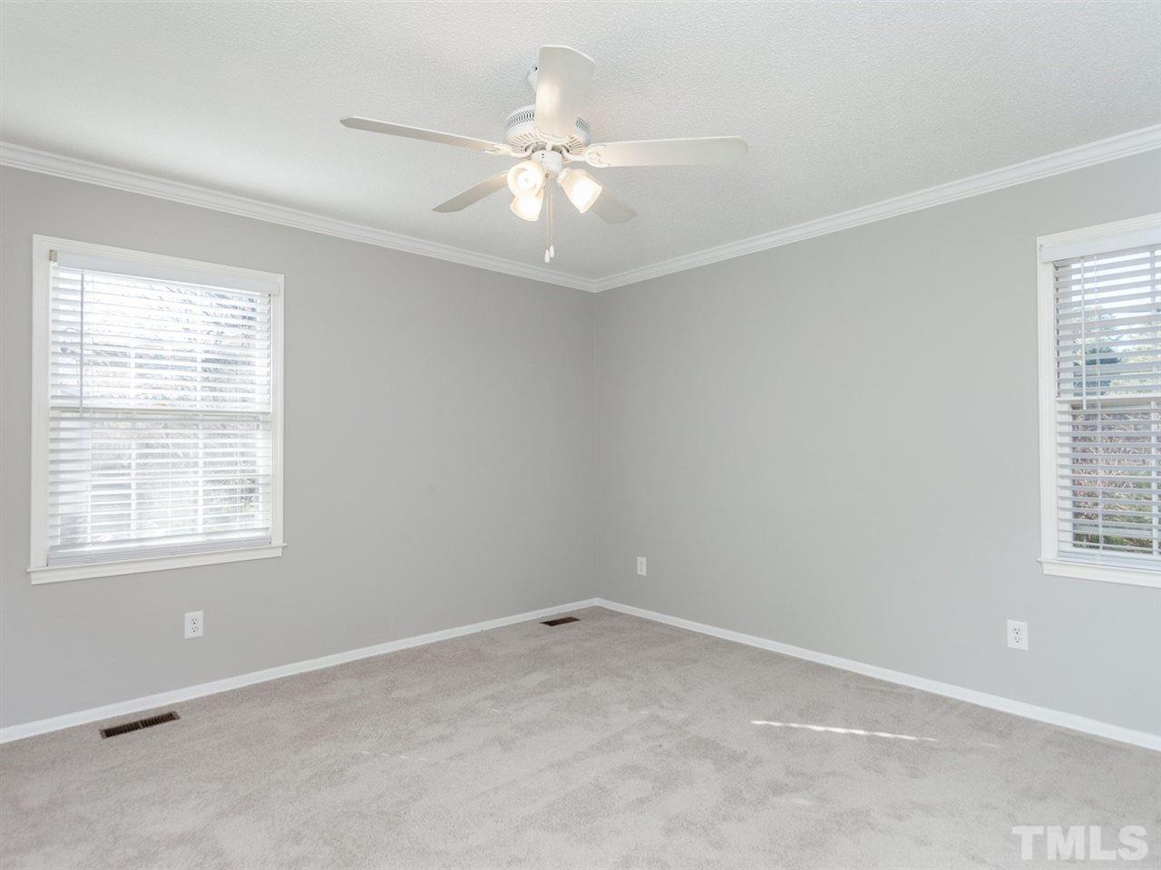 3000 Morningside Drive Raleigh, NC 27607 - Photo 6 of 25 an empty room with windows and fan