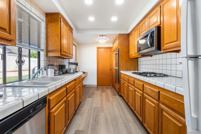 a living room with kitchen island furniture and a window