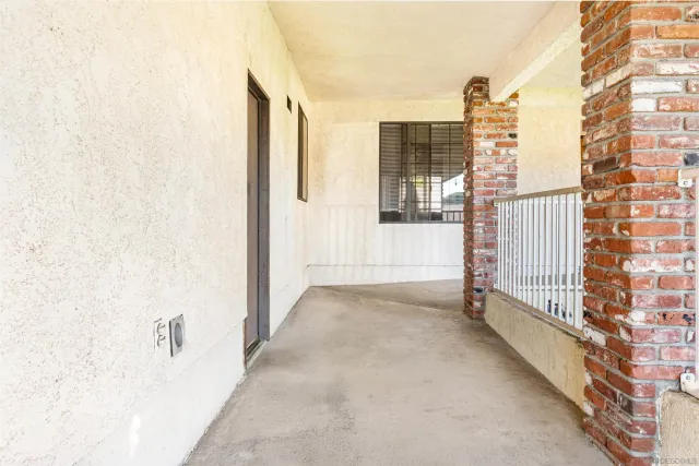 a view of a brick house with a large window