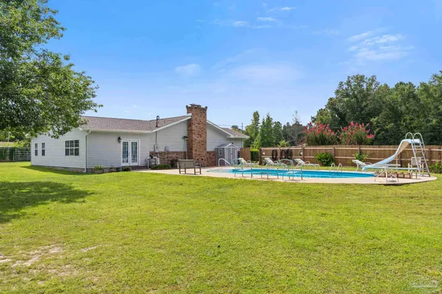 a view of a house with swimming pool