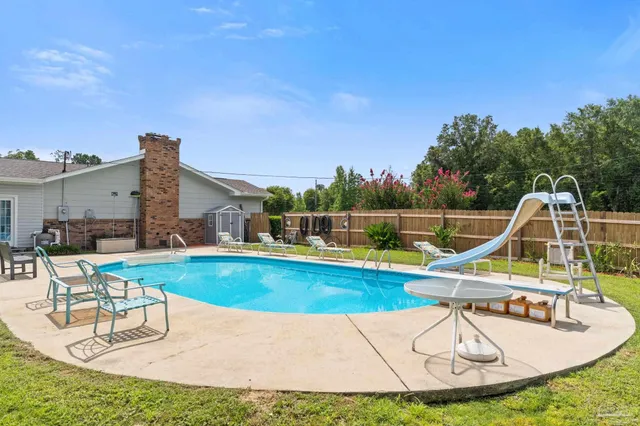 a view of a swimming pool with a patio
