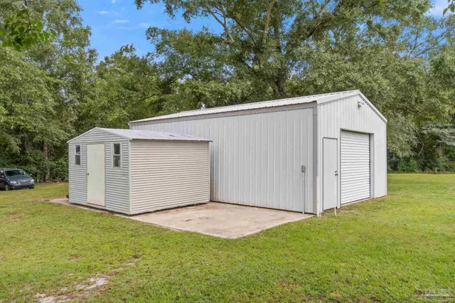 an aerial view of residential house with outdoor space