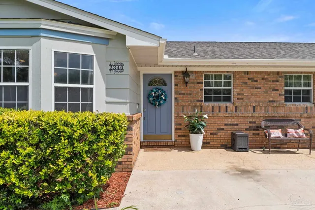 a front view of a house with outdoor space