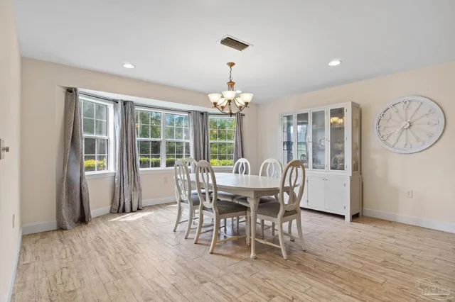 a view of a dining room with furniture