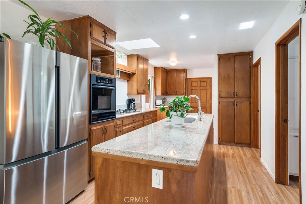 39444 Canyon Drive Forest Falls, CA 92339 - Photo 13 of 28 a kitchen with stainless steel appliances granite countertop a refrigerator a oven and a sink