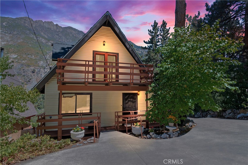 39444 Canyon Drive Forest Falls, CA 92339 - Photo 2 of 28 a view of a house with a yard and potted plants