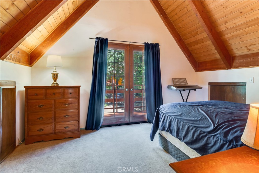 39444 Canyon Drive Forest Falls, CA 92339 - Photo 21 of 28 a bedroom with a bed and a dresser