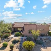 a view of a patio with table and chairs and a fire pit