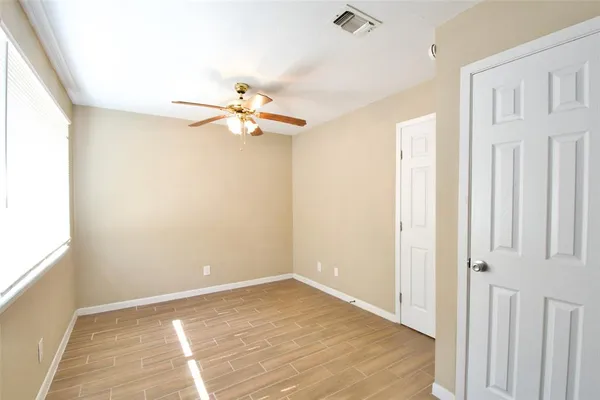 a view of an empty room with a window