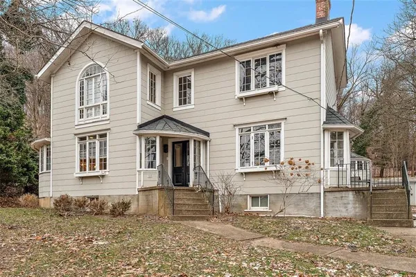 a front view of a house with a yard