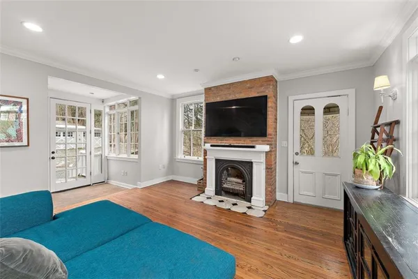 a living room with furniture and a fireplace