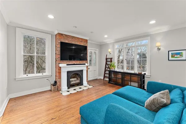 a living room with furniture and a fireplace