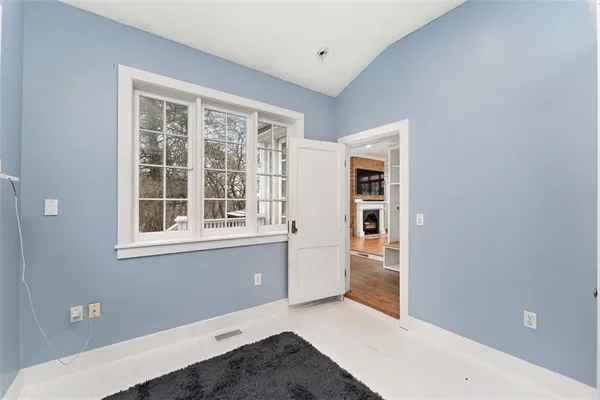 a view of an empty room with a window